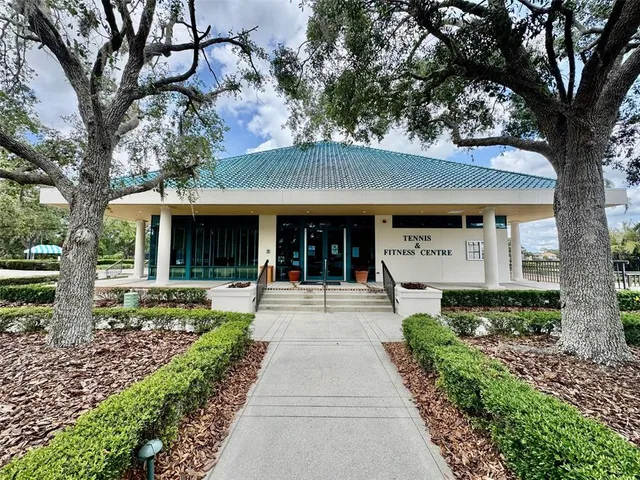 a front view of a house with a garden and porch