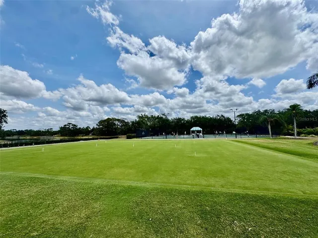 a room with lots of chairs and mirrors