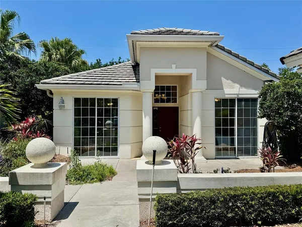 a house view with a sitting space and garden space