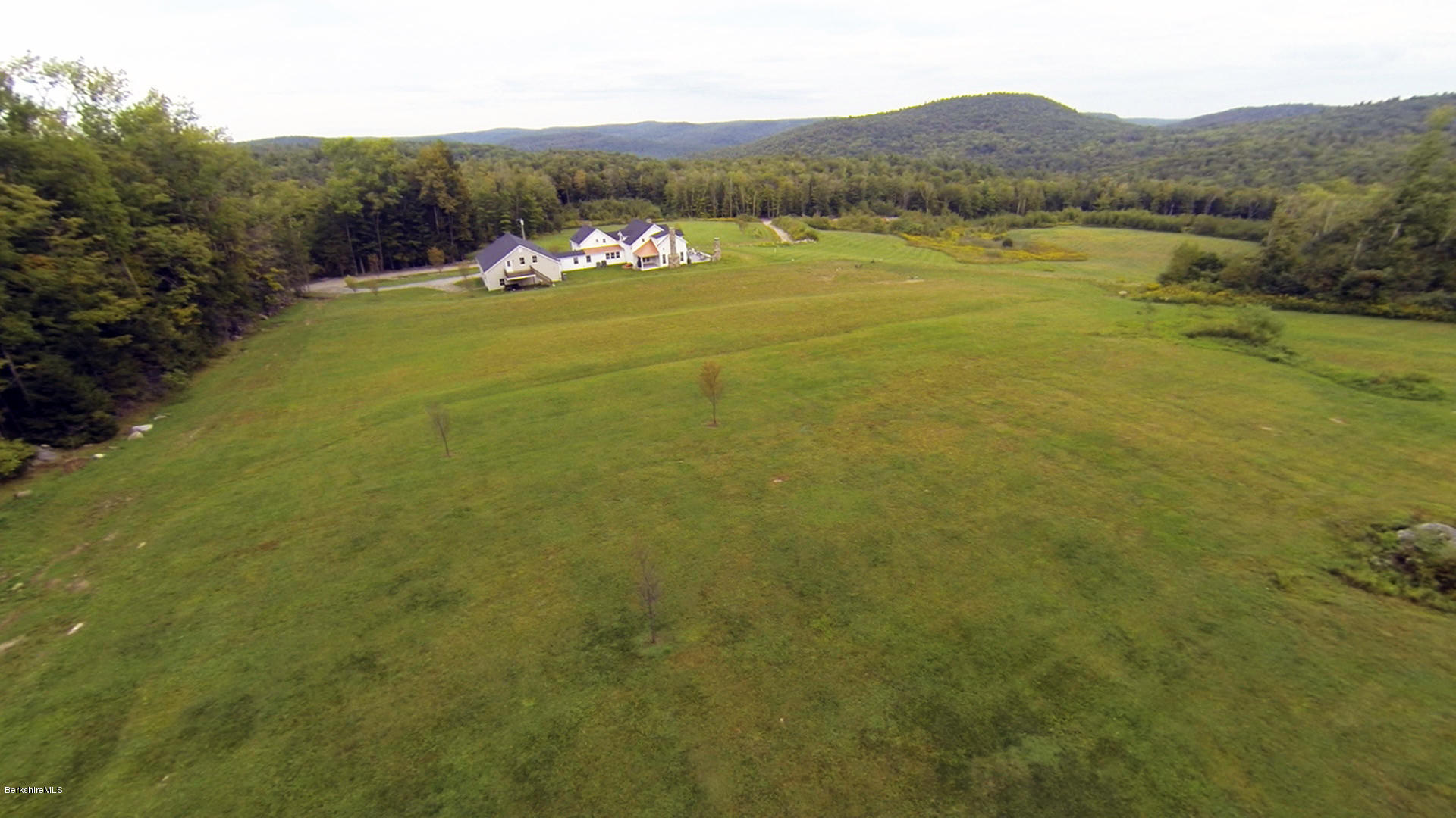 40 Viets Road Sandisfield, MA 01255 - Photo 15 of 92 a view of a lake with mountains in the background