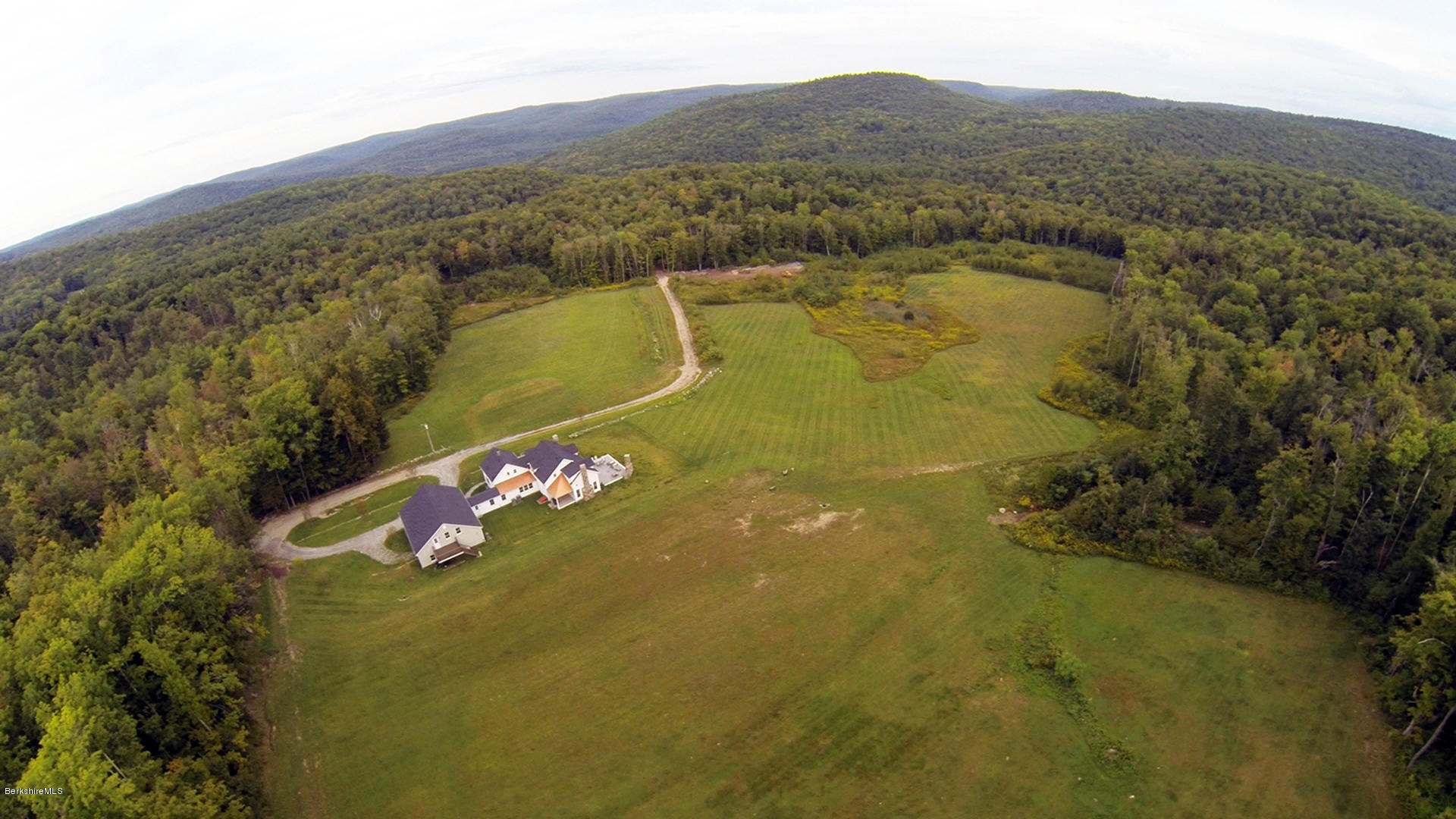 40 Viets Road Sandisfield, MA 01255 - Photo 17 of 92 a view of a lake with a mountain in the background