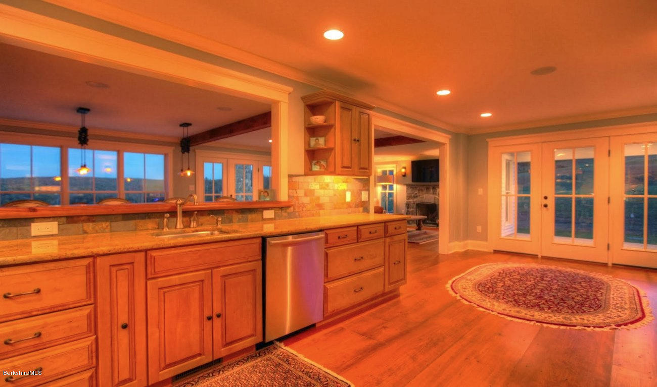 40 Viets Road Sandisfield, MA 01255 - Photo 24 of 92 a large kitchen with stainless steel appliances granite countertop a sink and cabinets with wooden floor