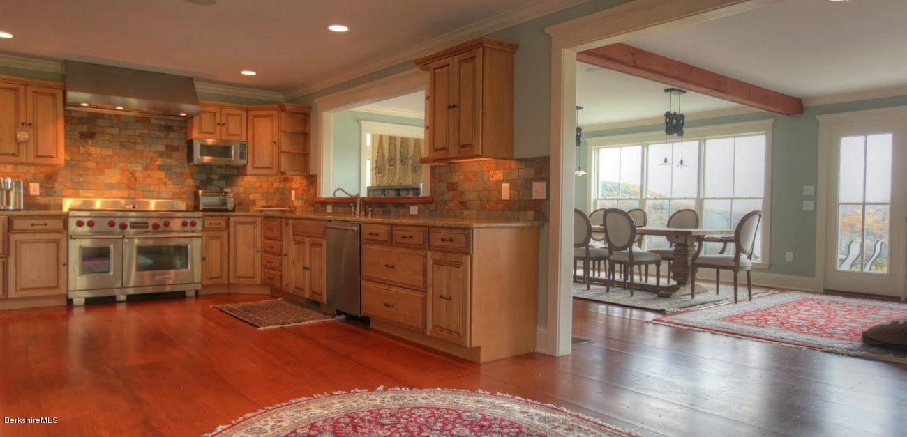 40 Viets Road Sandisfield, MA 01255 - Photo 25 of 92 a kitchen with stainless steel appliances granite countertop a stove and a refrigerator