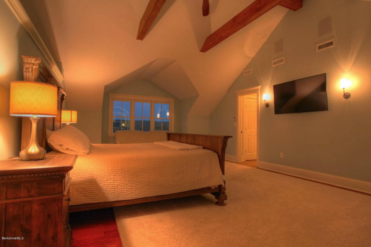40 Viets Road Sandisfield, MA 01255 - Photo 36 of 92 a bedroom with a bed and lamp