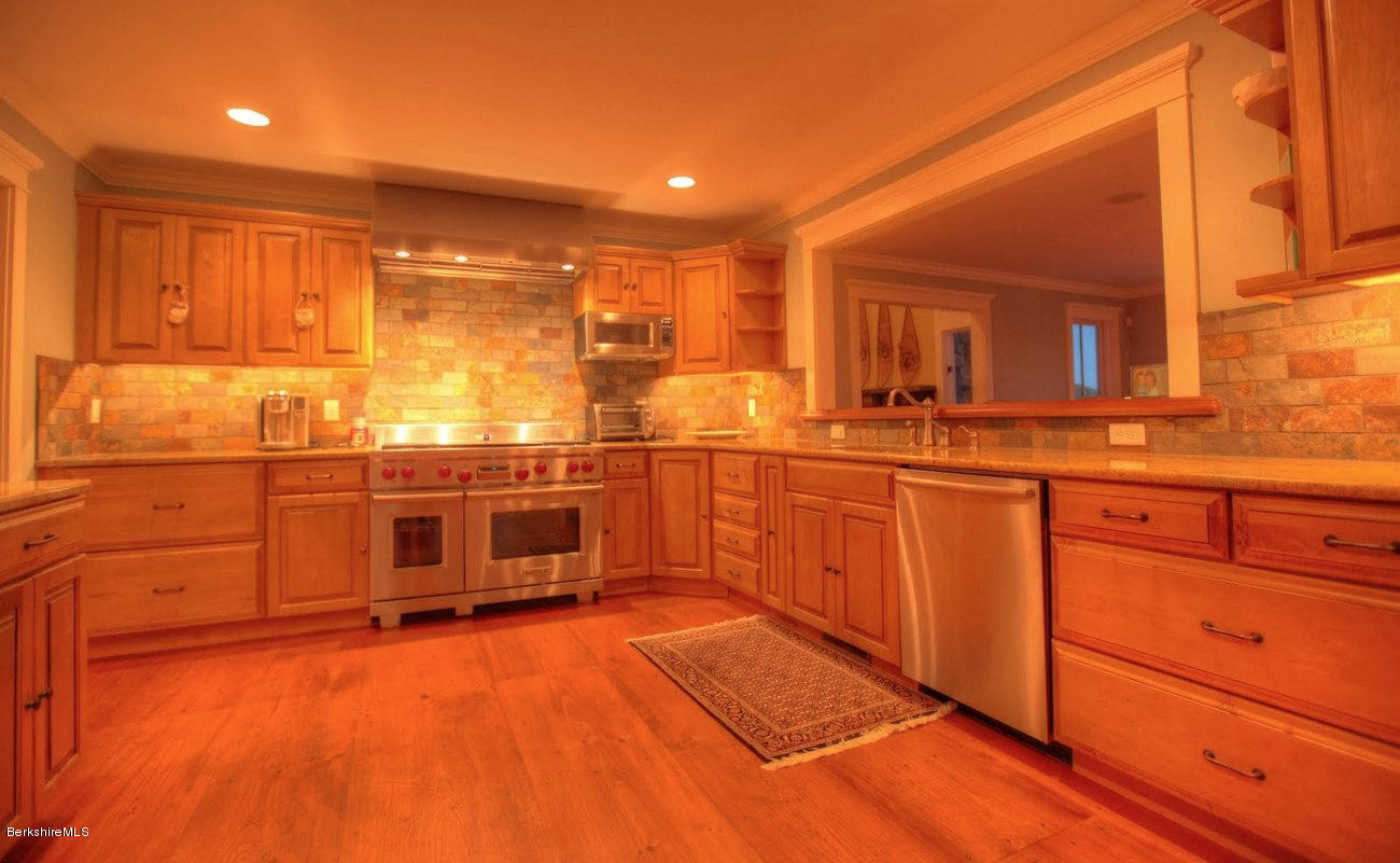 40 Viets Road Sandisfield, MA 01255 - Photo 65 of 92 a kitchen with stainless steel appliances granite countertop a sink and cabinets