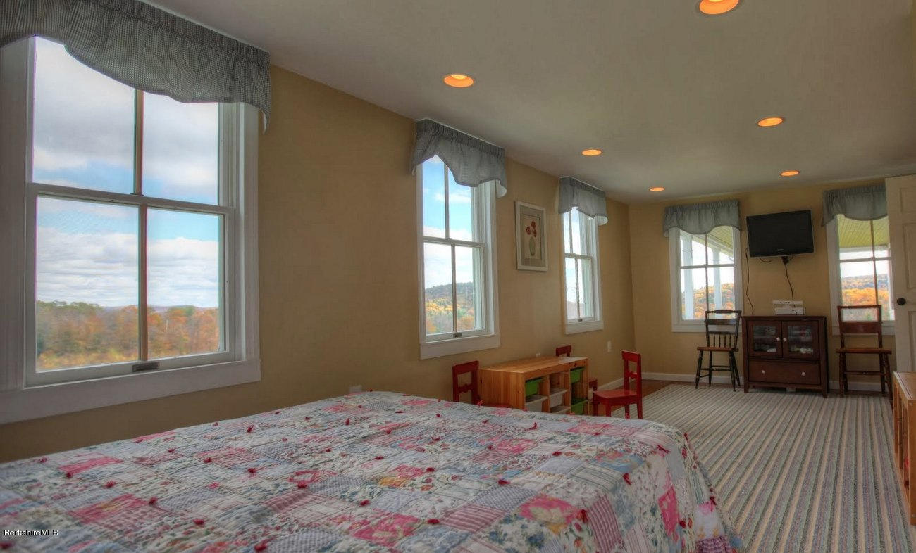 40 Viets Road Sandisfield, MA 01255 - Photo 75 of 92 a bedroom with a bed and wooden floor