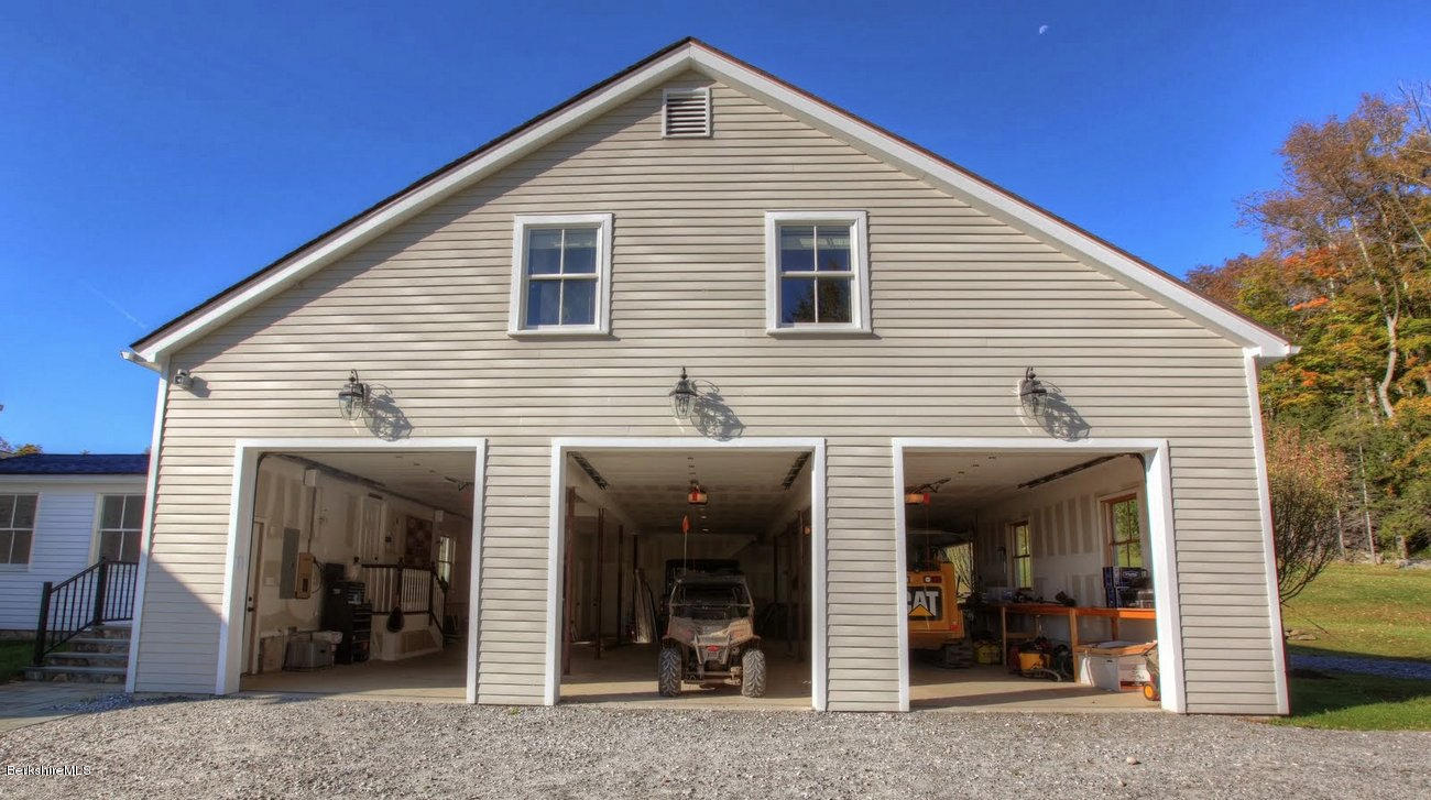 40 Viets Road Sandisfield, MA 01255 - Photo 84 of 92 a view of a house with glass windows and furniture