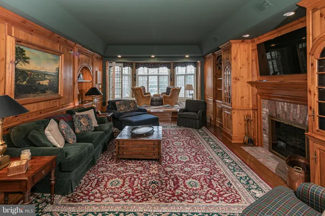 a living room with furniture and a rug