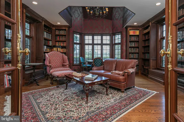 a living room with furniture a rug and a fireplace