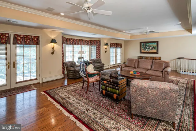 a bathroom with a granite countertop sink a toilet and bathtub