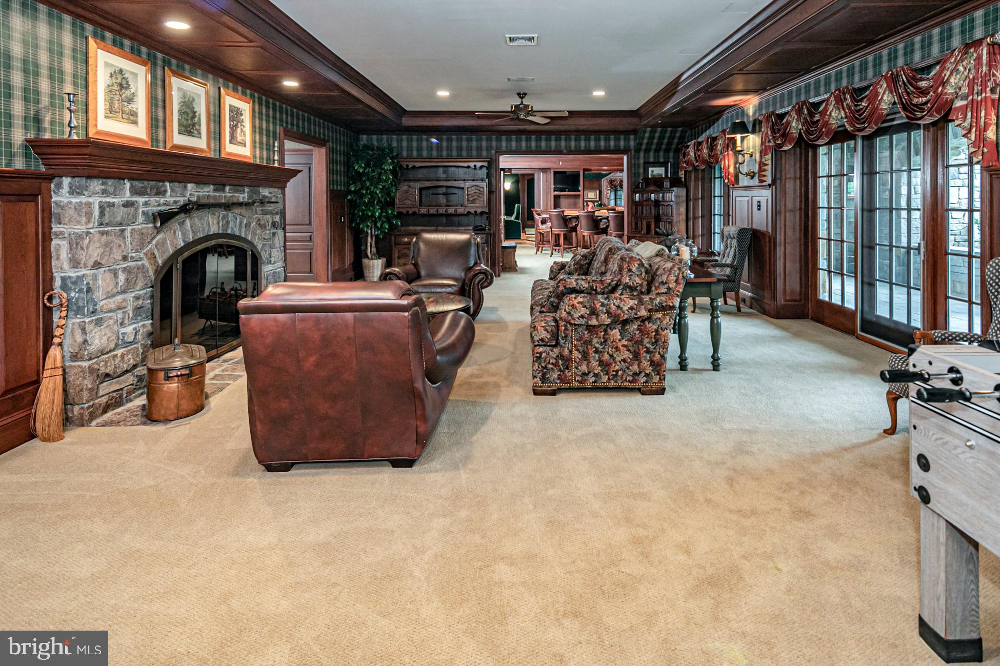 82 Aunt Molly Road Hopewell, NJ 08525 - Photo 33 of 55 a living room with furniture a fireplace and a chandelier