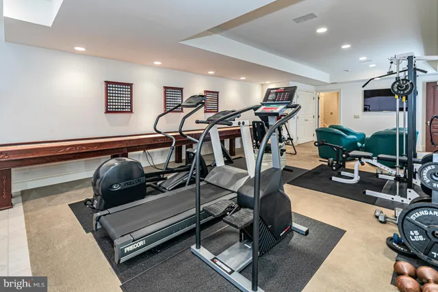 a bathroom with a sink a toilet and shower curtain