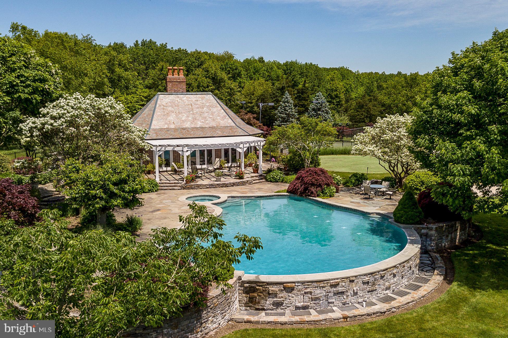 82 Aunt Molly Road Hopewell, NJ 08525 - Photo 39 of 55 a view of a swimming pool with an outdoor seating