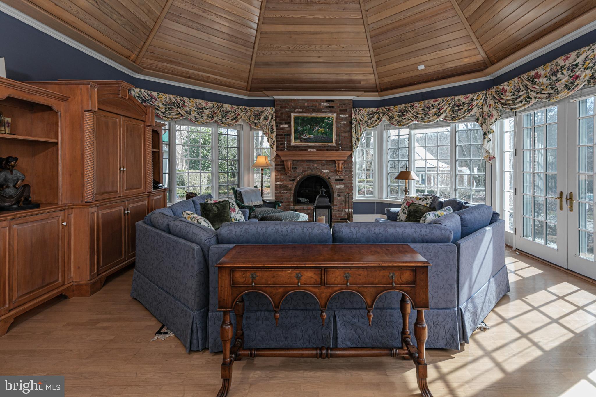 82 Aunt Molly Road Hopewell, NJ 08525 - Photo 10 of 55 a living room with furniture a fireplace and a table