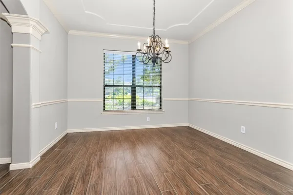 a view of a livingroom with wooden floor