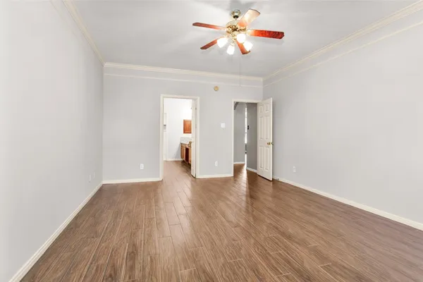 a bathroom with a granite countertop sink a mirror and shower