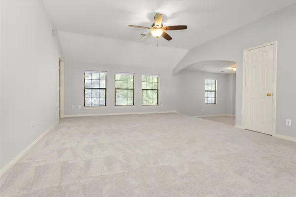 a view of work space with furniture and a ceiling fan