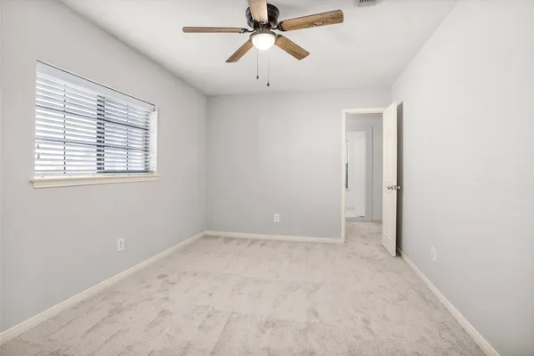 a view of closet area with stairs