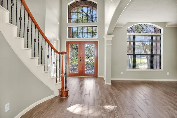 a view of a large window with wooden floor