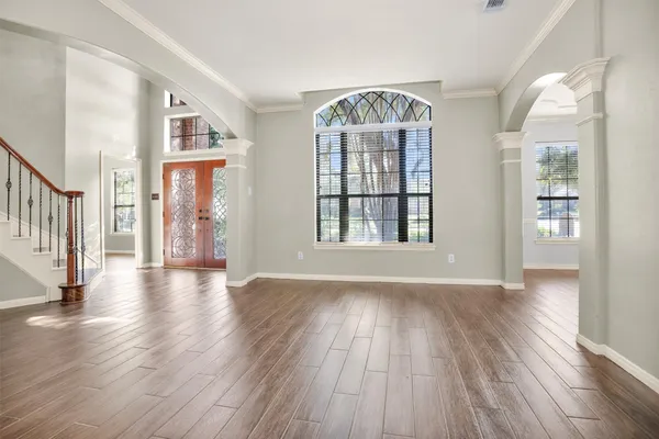 a view of an entryway with wooden floor