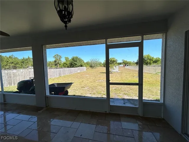 a view of a floor to ceiling window in an empty room