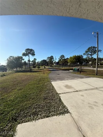 a view of a lake with a yard
