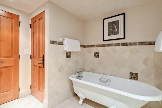 a bathroom with a tub and shower