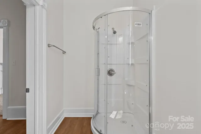 a bathroom with a granite countertop shower
