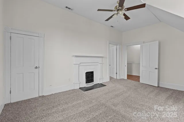 a view of empty room with fan