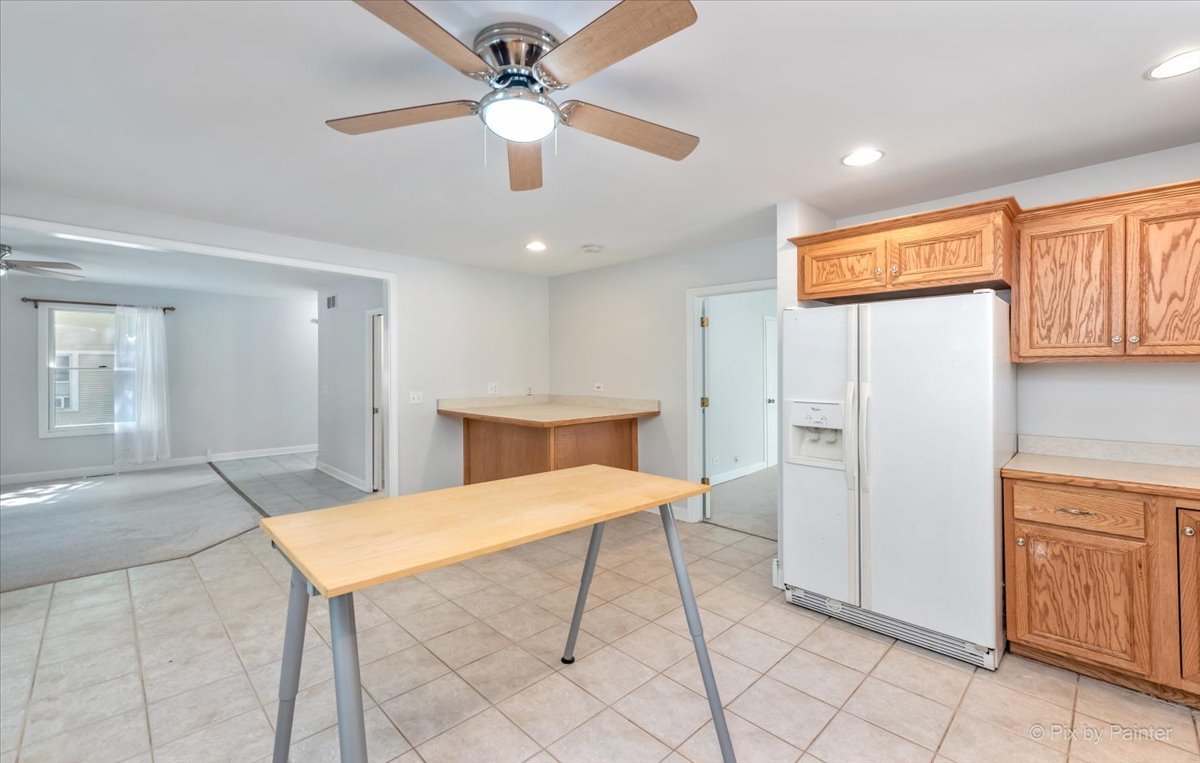 30 Crissey Avenue Geneva, IL 60134 - Photo 11 of 48 a large kitchen with a table and chairs