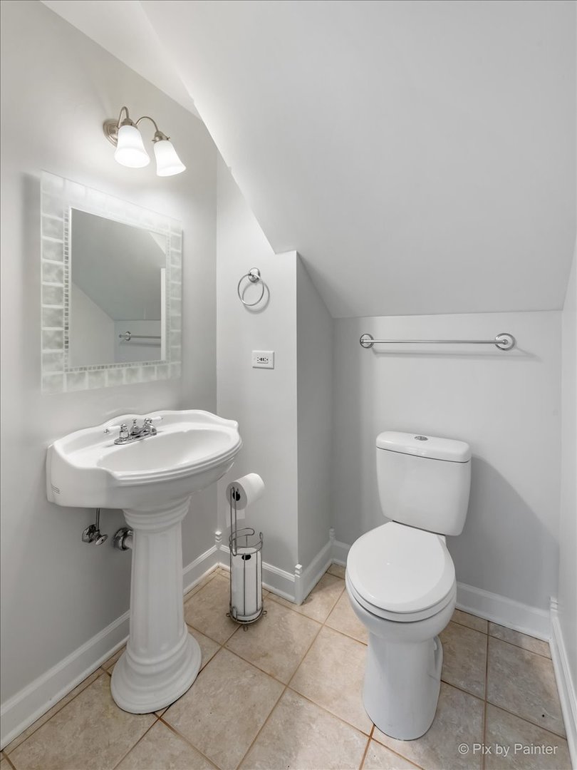 30 Crissey Avenue Geneva, IL 60134 - Photo 16 of 48 a bathroom with a toilet sink and mirror