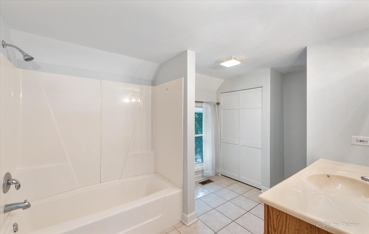 30 Crissey Avenue Geneva, IL 60134 - Photo 18 of 48 a bathroom with a bathtub and a shower