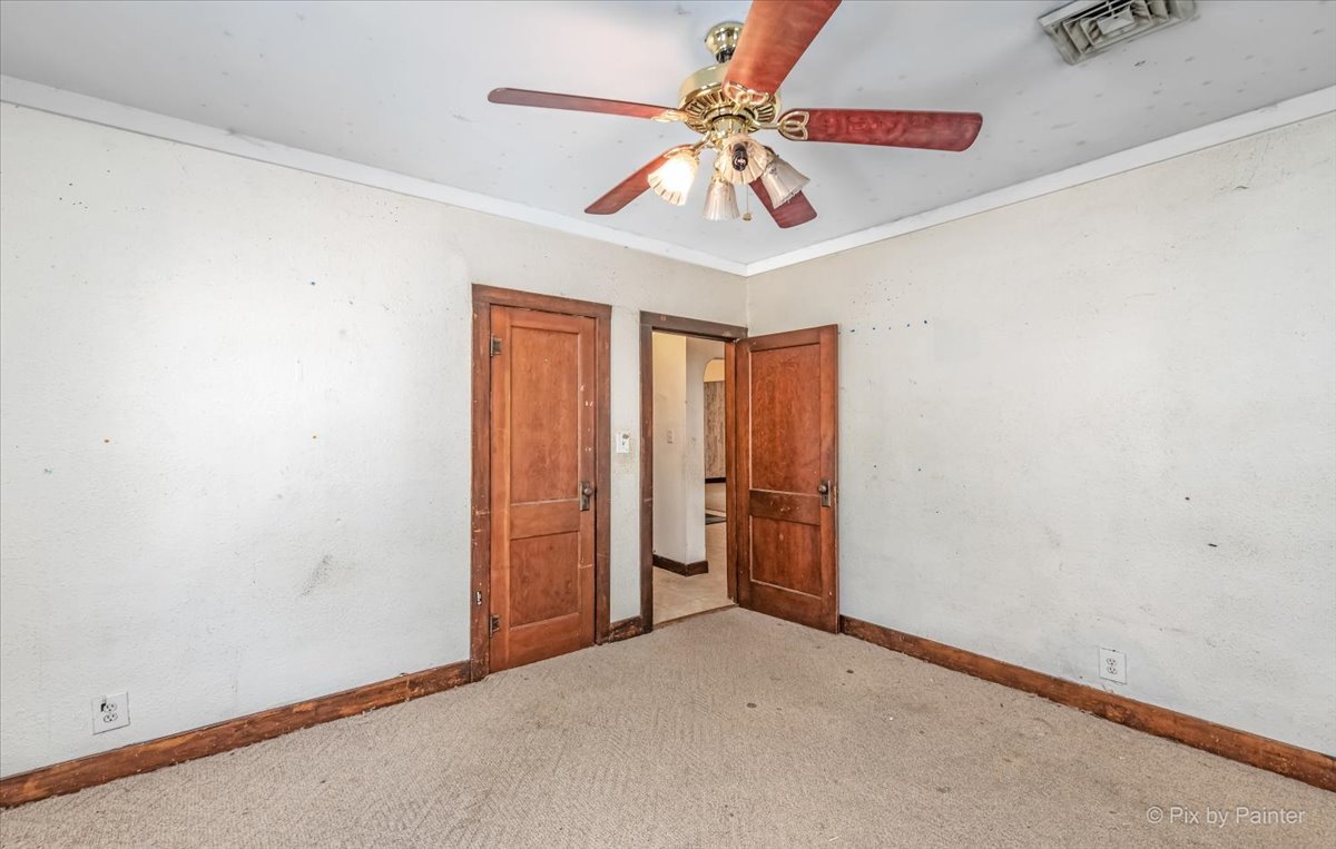 30 Crissey Avenue Geneva, IL 60134 - Photo 38 of 48 an empty room with a chandelier fan and windows