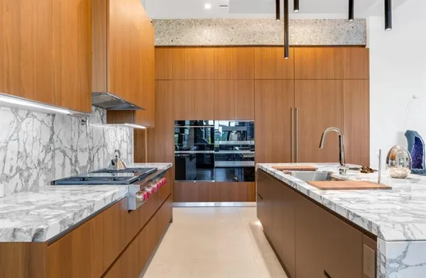 a view of living room with granite countertop furniture and fireplace