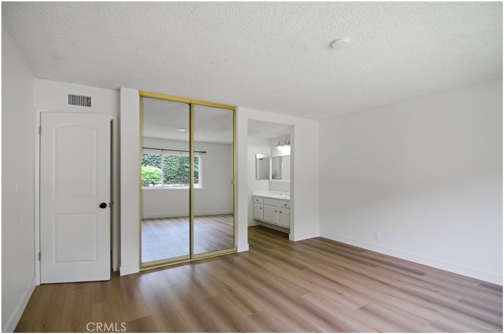 1110 Redding Avenue Costa Mesa, CA 92626 - Photo 21 of 30 a view of empty room with wooden floor