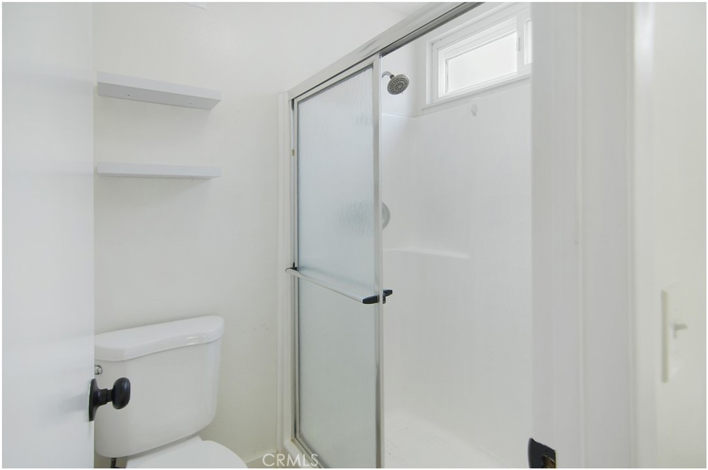 1110 Redding Avenue Costa Mesa, CA 92626 - Photo 23 of 30 a bathroom with a toilet and a shower
