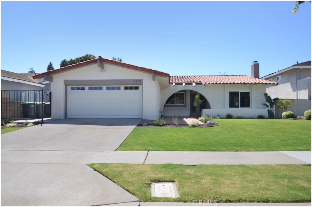 1110 Redding Avenue Costa Mesa, CA 92626 - Photo 3 of 30 a front view of a house with a garden and plants