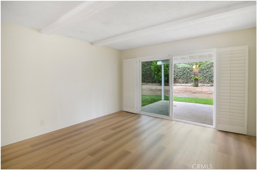 1110 Redding Avenue Costa Mesa, CA 92626 - Photo 10 of 30 wooden floor in an empty room with a window