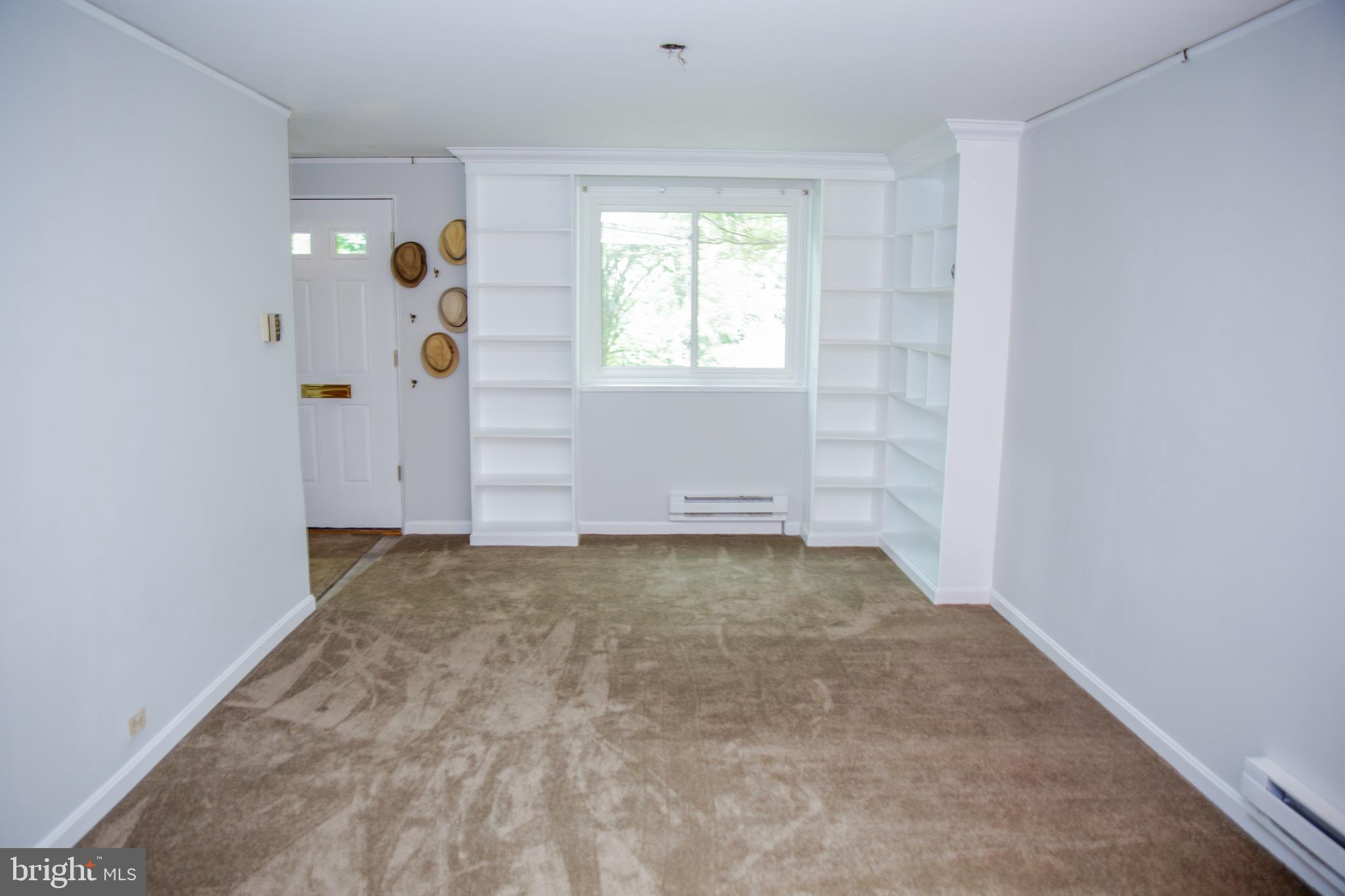 6 Ridge Road, Unit R Greenbelt, MD 20770 - Photo 5 of 20 Built-in bookcases flank a living room window