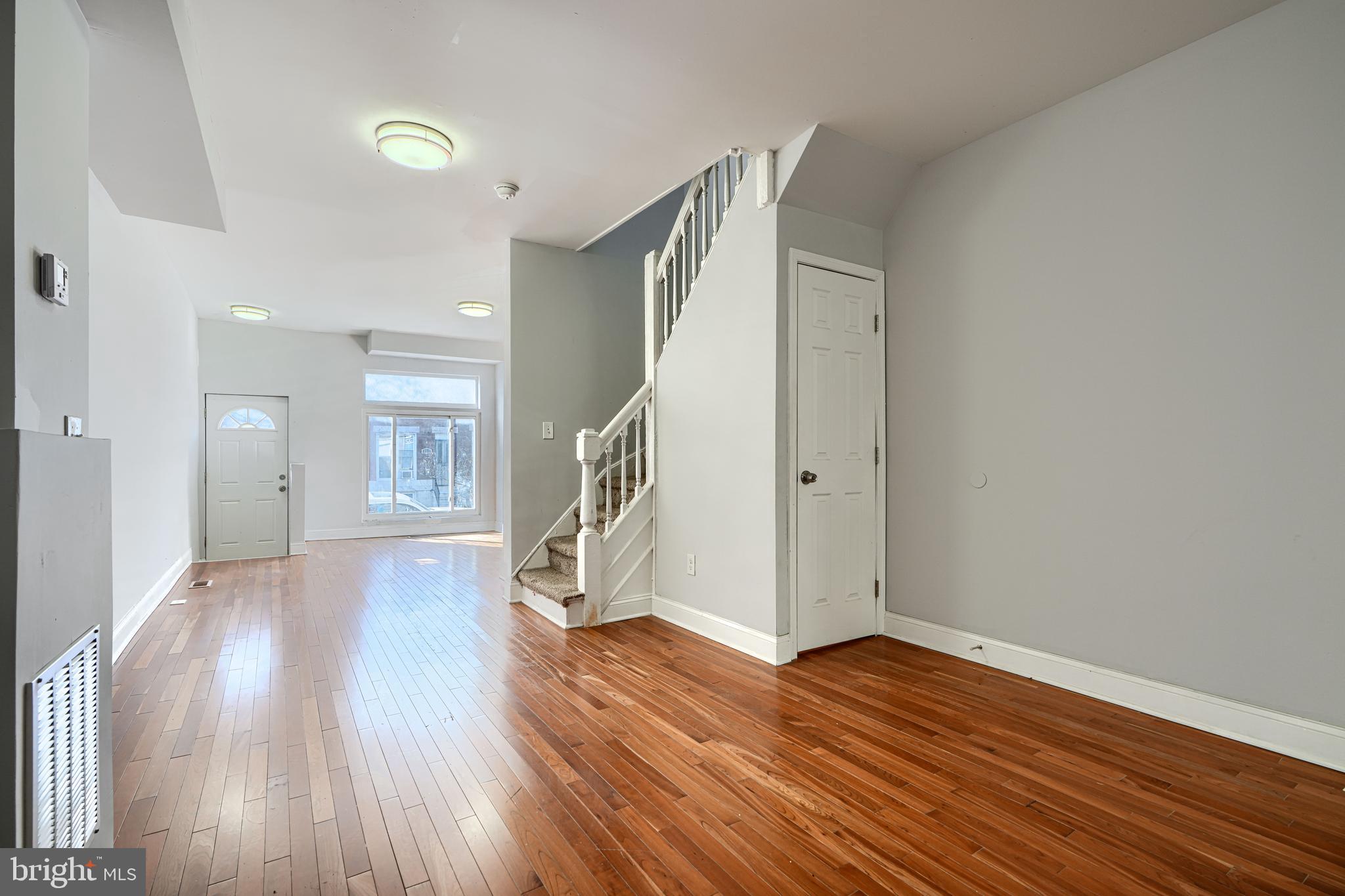 2511 McCulloh Street Baltimore, MD 21217 - Photo 11 of 35 a view of empty room with wooden floor and fan