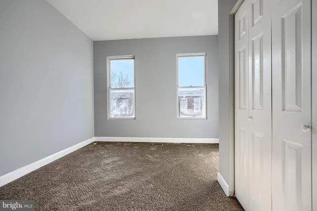 an empty room with windows