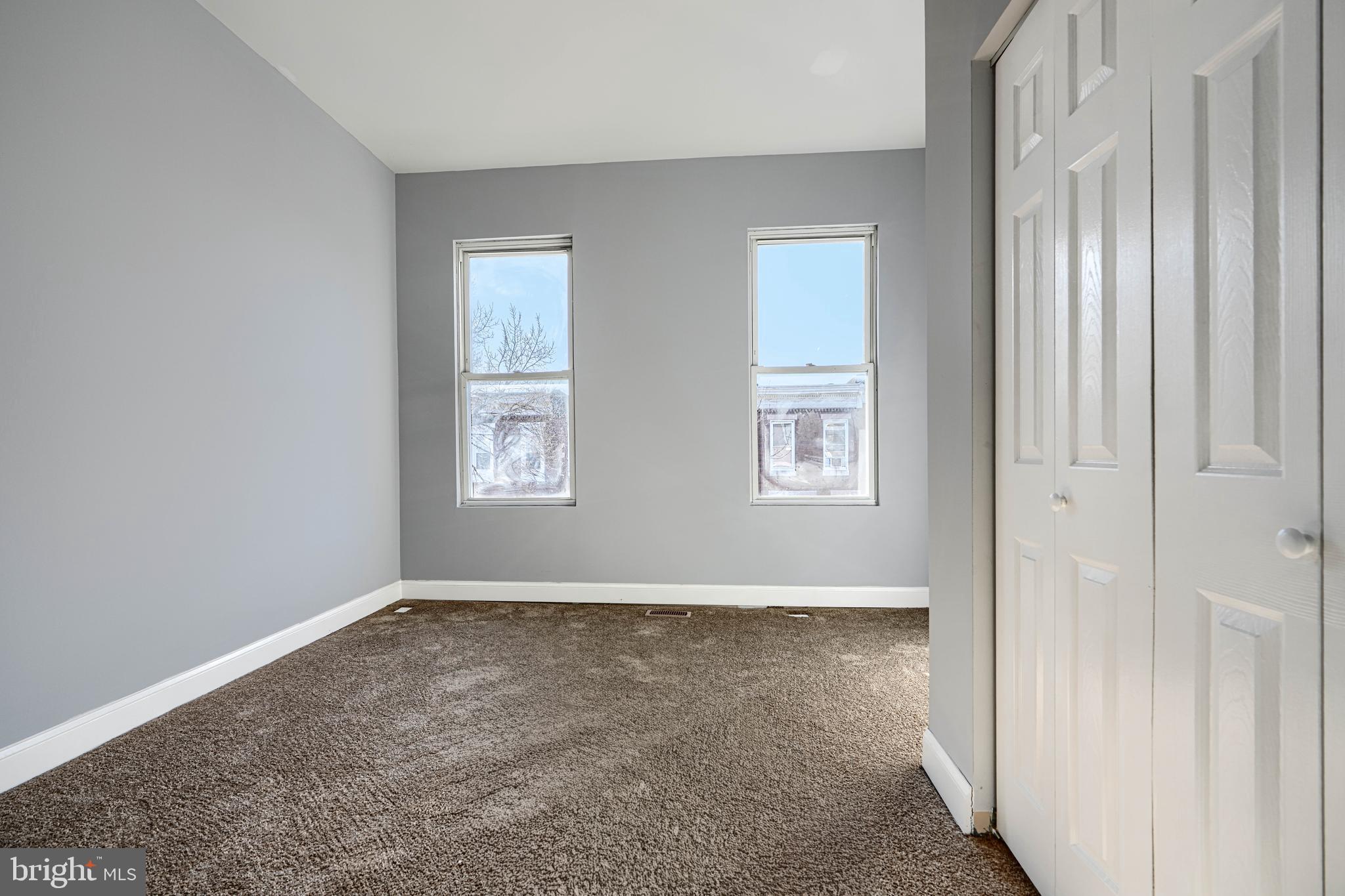 2511 McCulloh Street Baltimore, MD 21217 - Photo 18 of 32 an empty room with windows