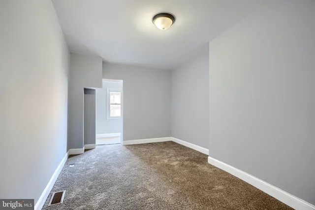 an empty room with an entryway