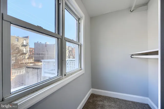 a view of a room that has a window