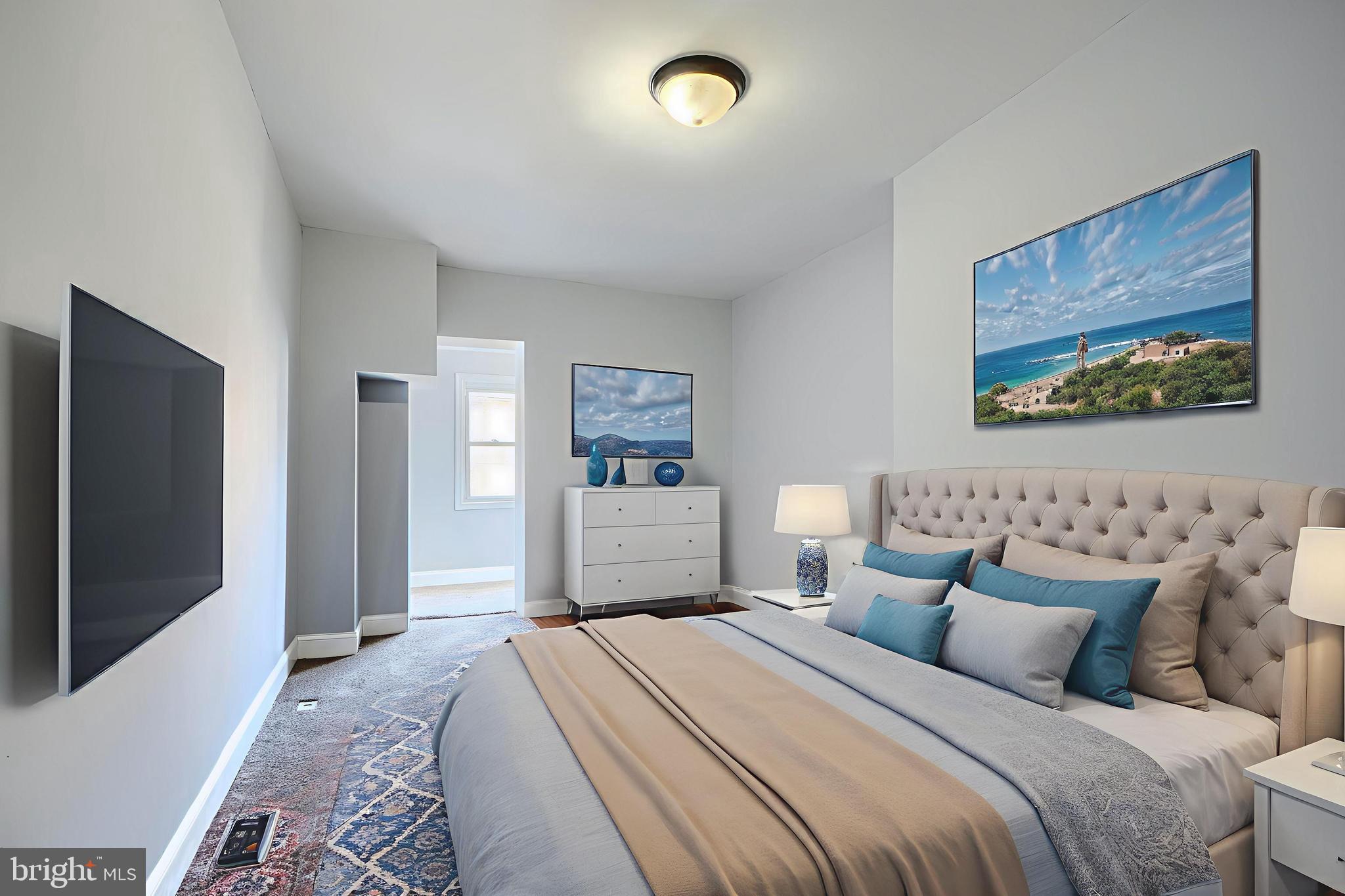 2511 McCulloh Street Baltimore, MD 21217 - Photo 25 of 35 a bedroom with a bed and a flat screen tv