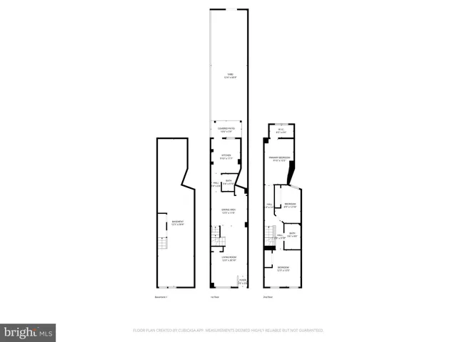 a blue and white car parked in front of a building