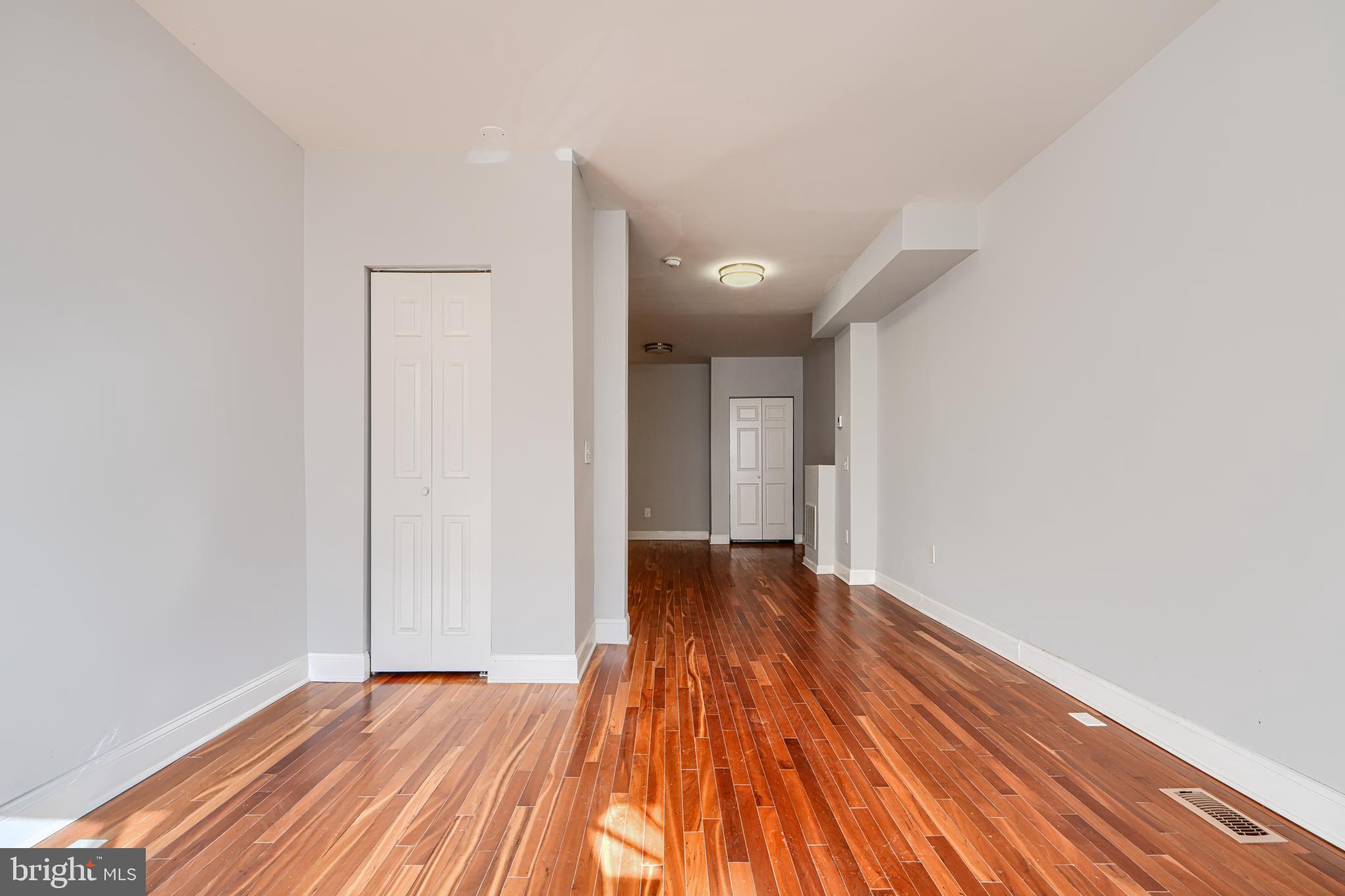 2511 McCulloh Street Baltimore, MD 21217 - Photo 5 of 32 a view of an empty room and wooden floor