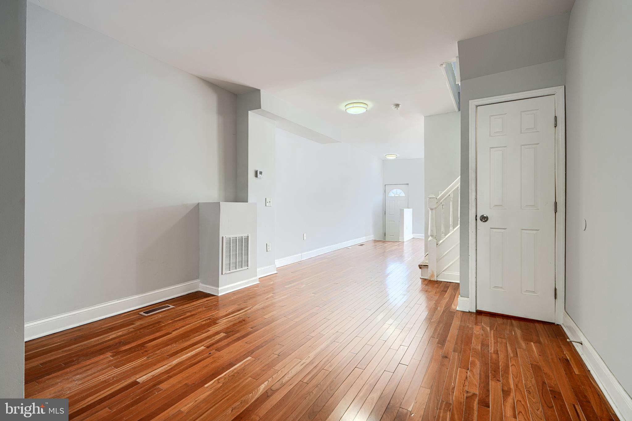 2511 McCulloh Street Baltimore, MD 21217 - Photo 10 of 32 wooden floor in an empty room with a window