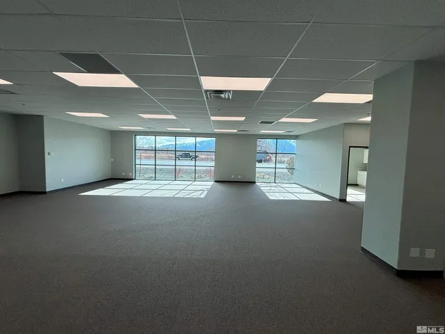 a view of empty room with windows