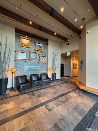 a view of a hall with couches and dinning table